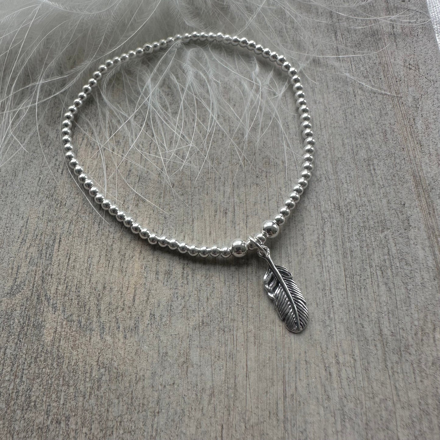 Stretch Feather Charm Bracelet, Dainty Layering Sterling Silver bracelet with feather