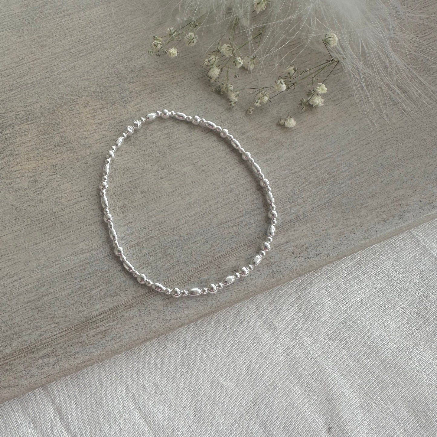 Stretchy Beaded Bracelet with oval beads for Layering, Sterling Silver elastic bracelet