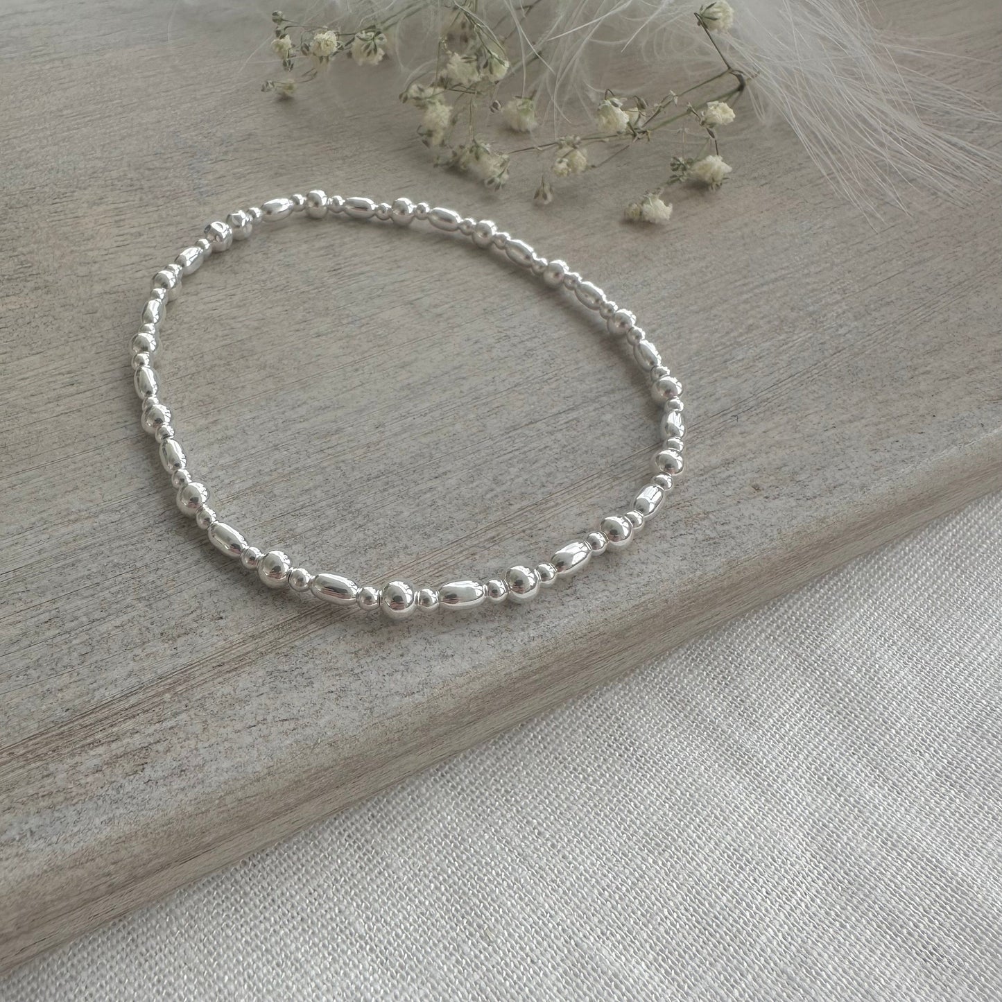 Stretchy Beaded Bracelet with oval beads for Layering, Sterling Silver elastic bracelet