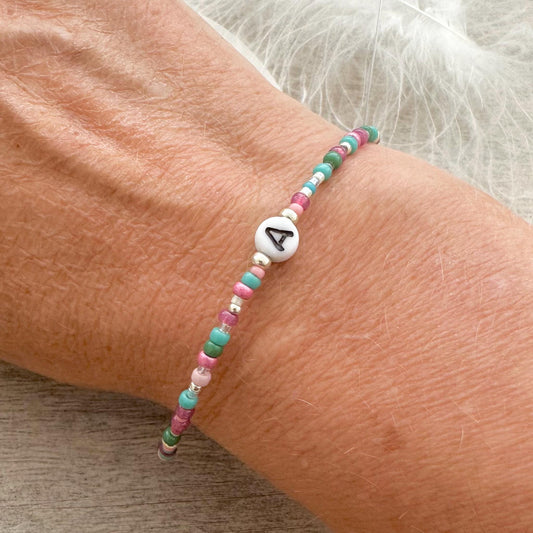 Beaded initial bracelet with personalised glass bead, colourful initial jewellery