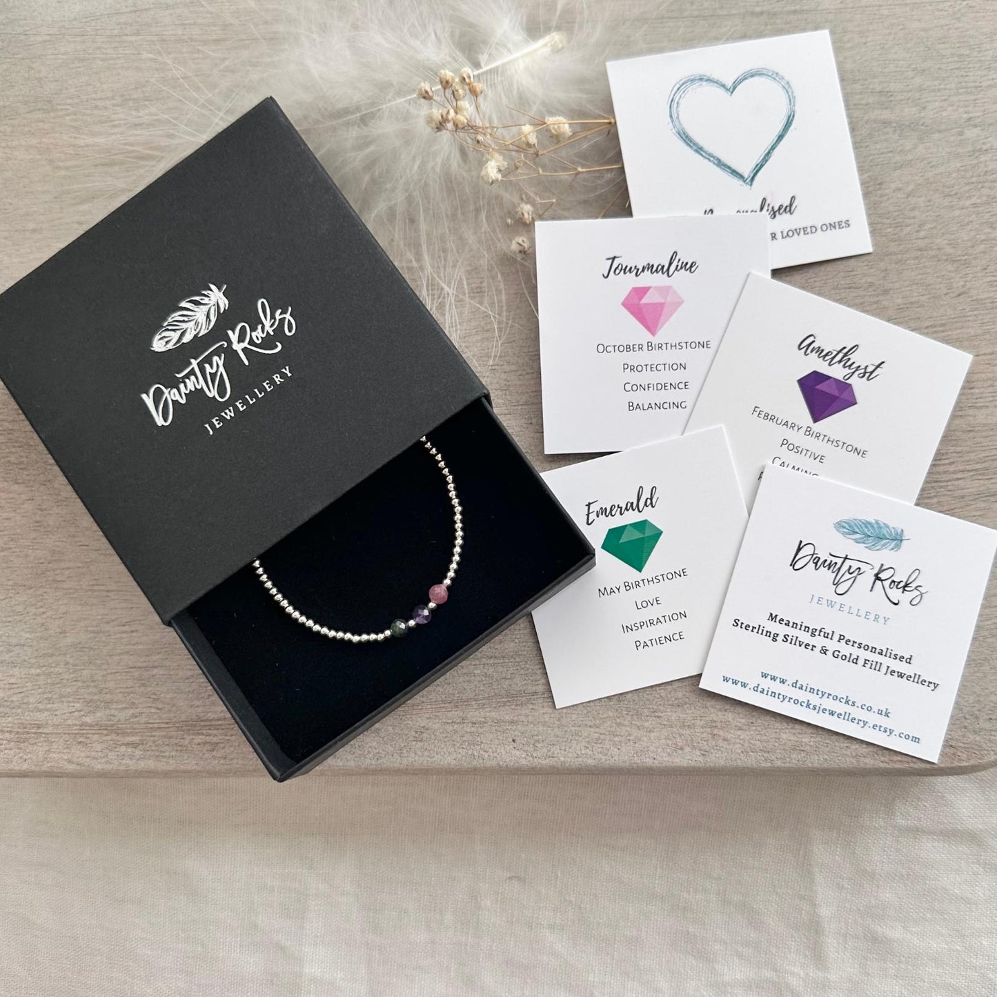 a box with a necklace and some cards