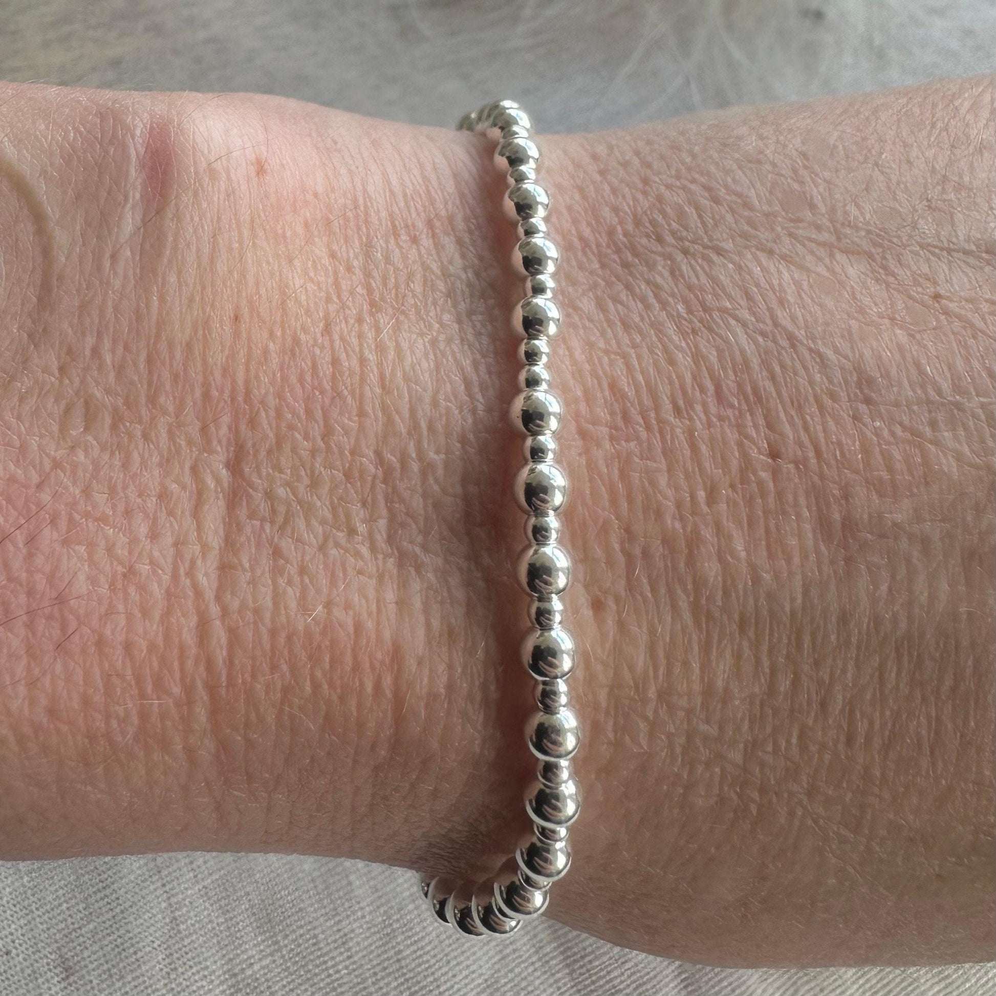 Stretchy 4mm Beaded Bracelet, Sterling Silver layering bracelet on stretch material